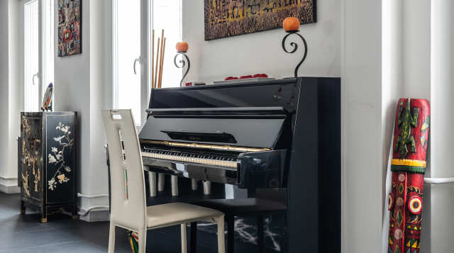 The piano at The Boardroom, Plum Guide home in Paris, France