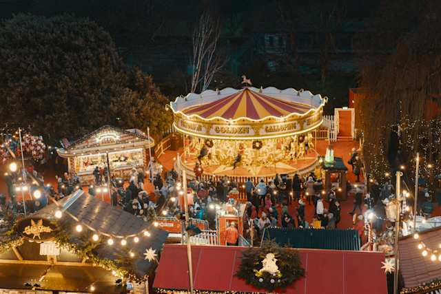 Carousel and Christmas lights at Edinburgh Christmas Market, Scotland, UK