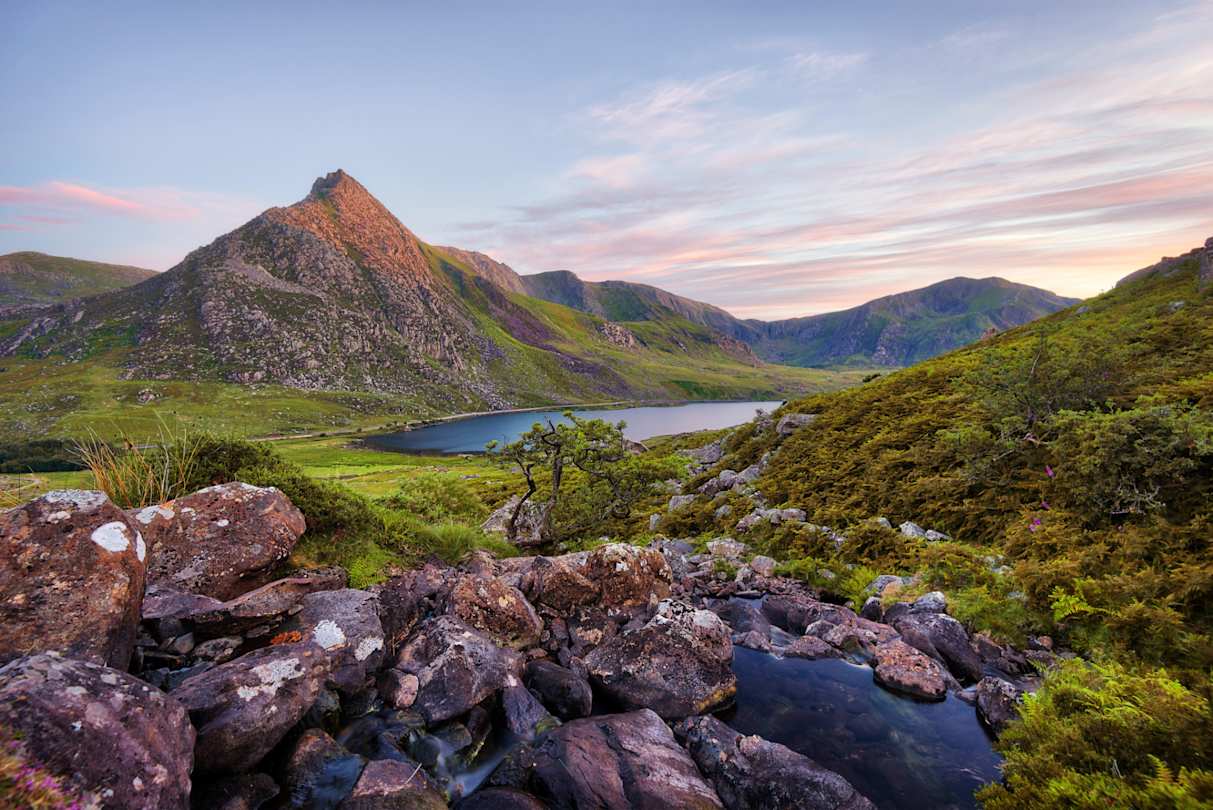 Snowdonia National Park in Northern Wales, with small lake and craggy mountains, Wales