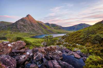 Snowdonia National Park in Northern Wales, with small lake and craggy mountains, Wales
