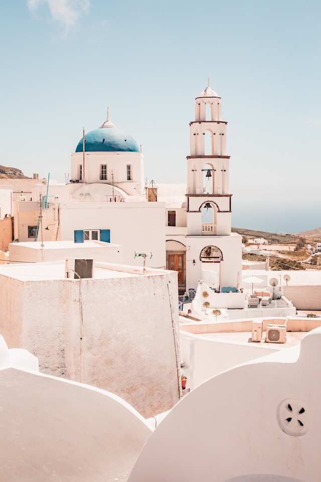 Blue dome and bell tower of Pyrgos Kallistis Castle, Santorini