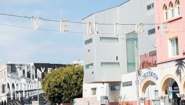 Venice sign hanging over the Ocean Front Walk in Venice Beach, Los Angeles
