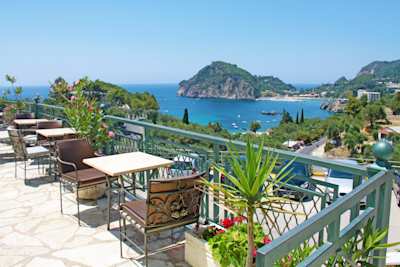 Rooftop terrace overlooking the sea and Paleokastritsa, Corfu, Greece