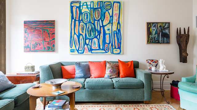 Living room with artwork above sofa in Plum Guide home, The Swirl House