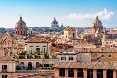 Cityscape with the dome of St. Peter's Basilica, the Vatican and rooftops, Rome