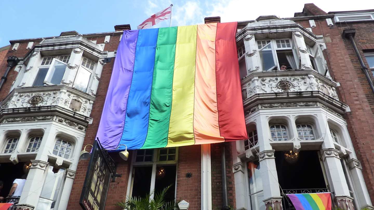 Rainbow flag draped from a London building
