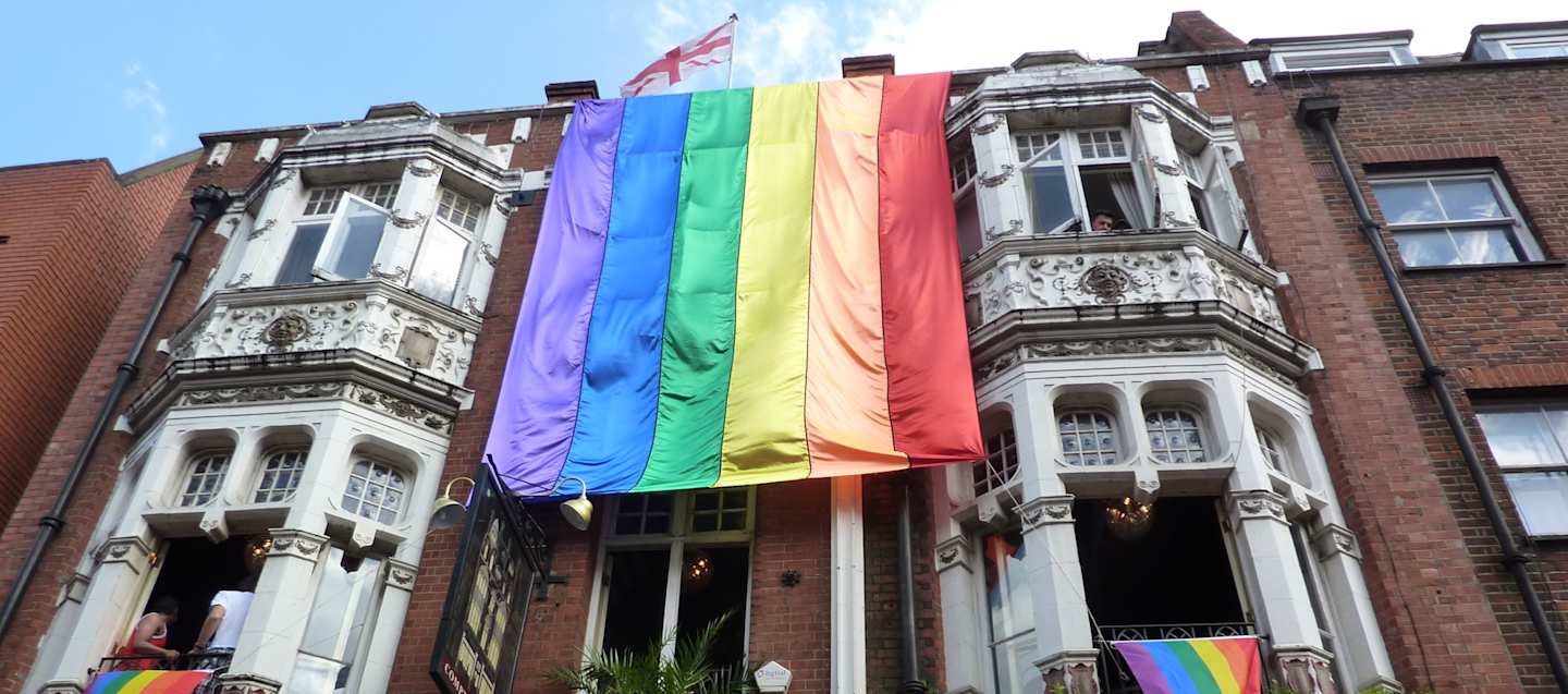Rainbow flag draped from a London building