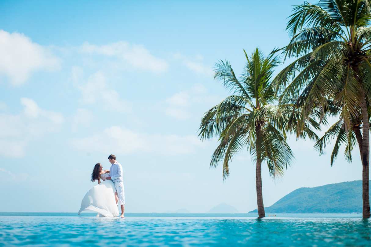 A newly-wed couple celebrating their wedding in an exotic destination