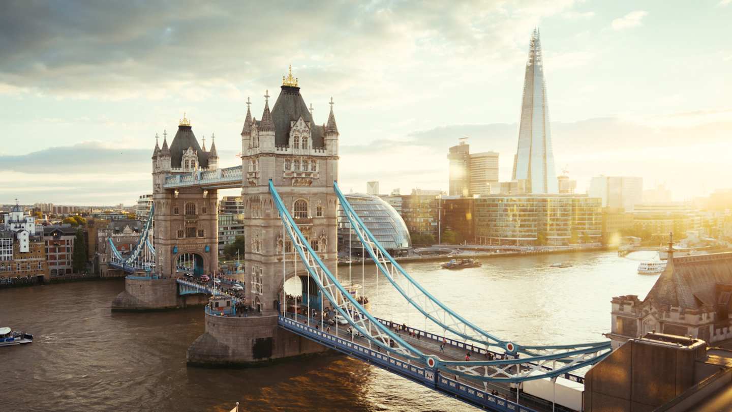 Tower Bridge, The Shard, and London City Hall along the Thames at sunset, London