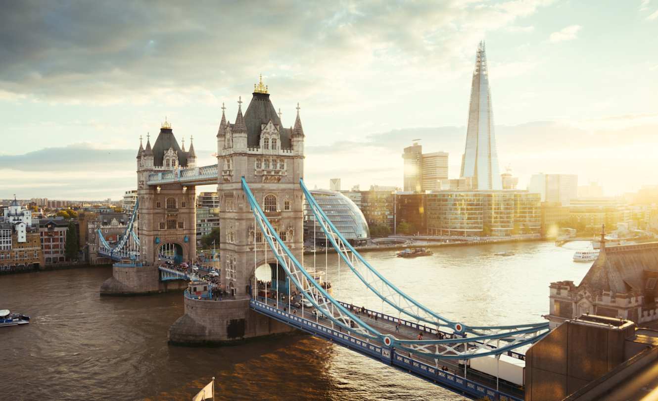 Tower Bridge, The Shard, and London City Hall along the Thames at sunset, London
