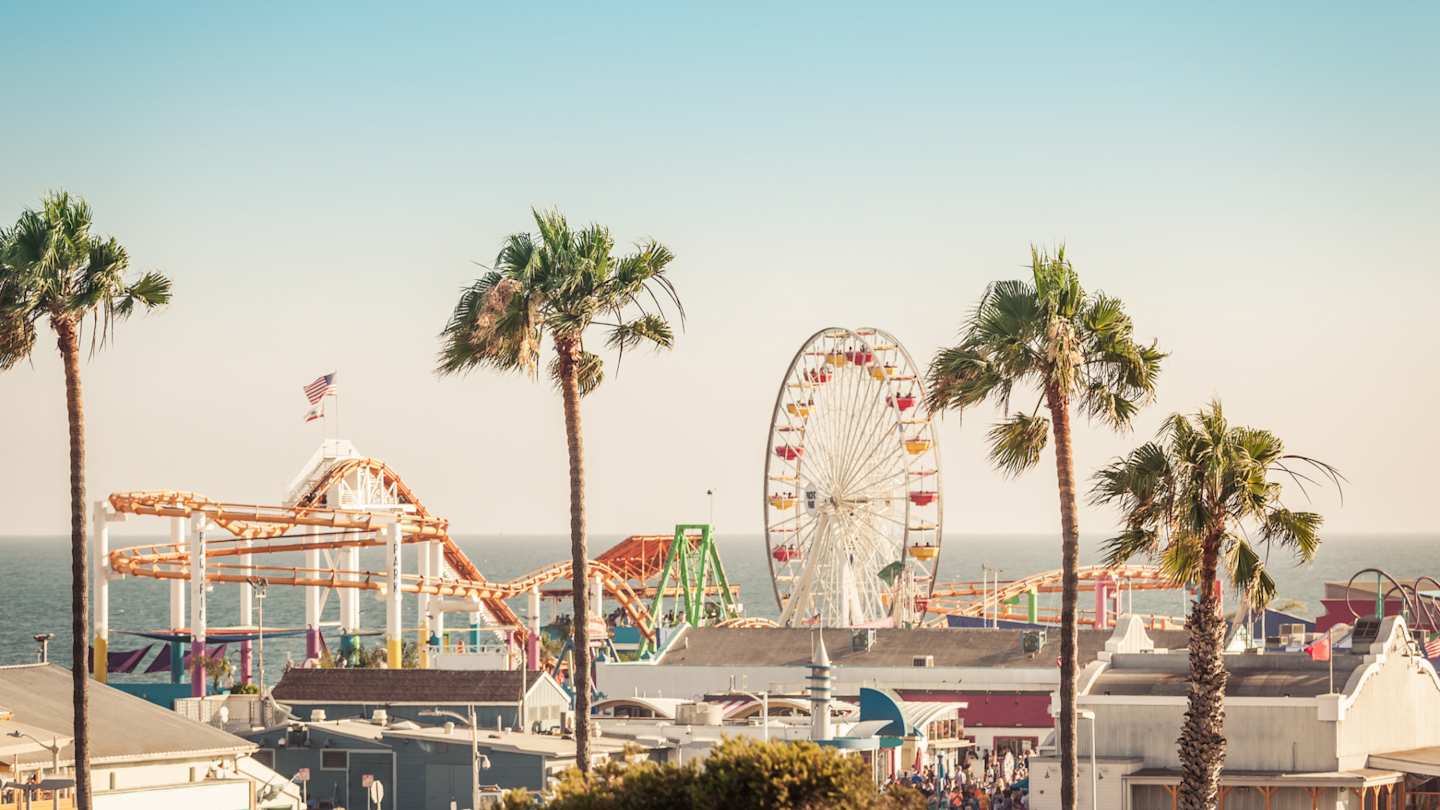 Amusement park with Ferris wheel on Santa Monica Pier, Los Angeles