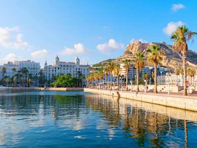 Beautiful waterfront promenade with palm trees in Alicante, Spain