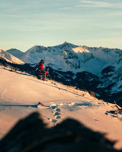 People skiing down a mountain in Aspen, Colorado
