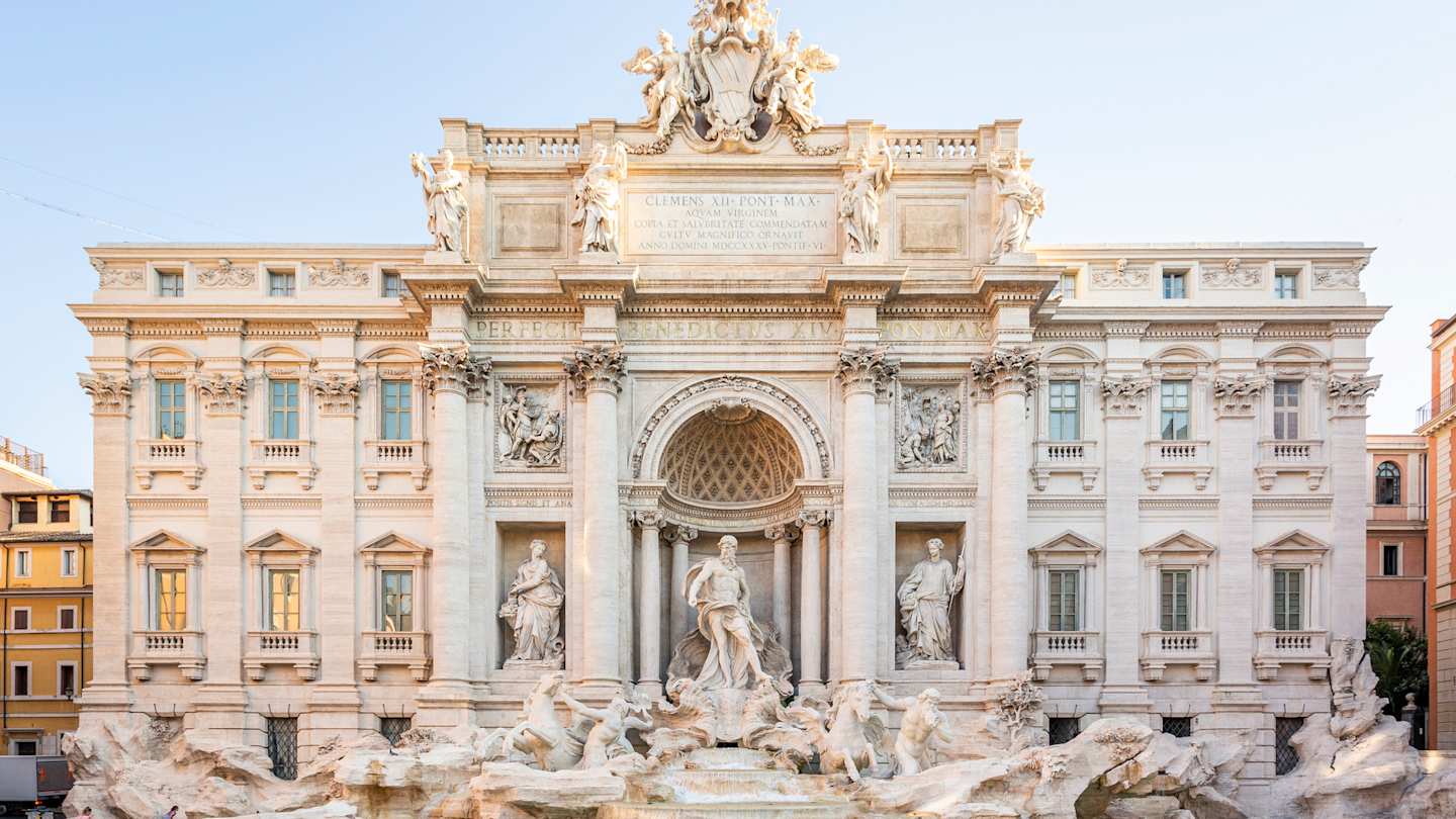 Trevi Fountain in the early hours of a sunny summer's day, Rome, Italy
