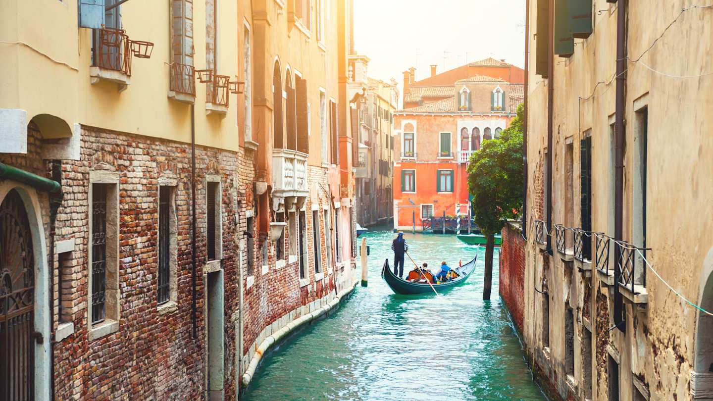 Beautiful canal with old medieval architecture and gondola, Venice, Italy