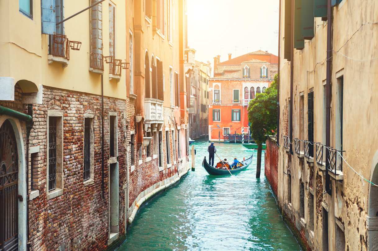 Beautiful canal with old medieval architecture and gondola, Venice, Italy