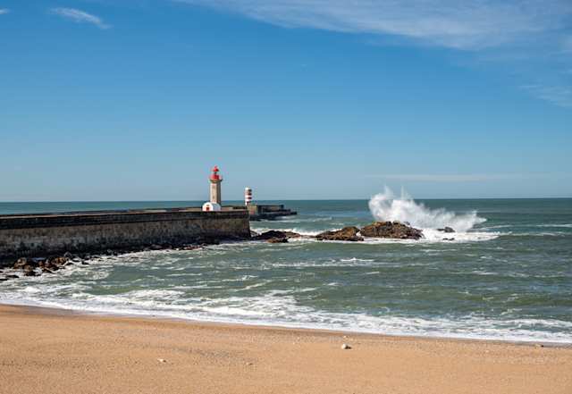 Waves crashing near Farolim de Felgueiras lighthouse in Foz do Douro, Porto, Portugal