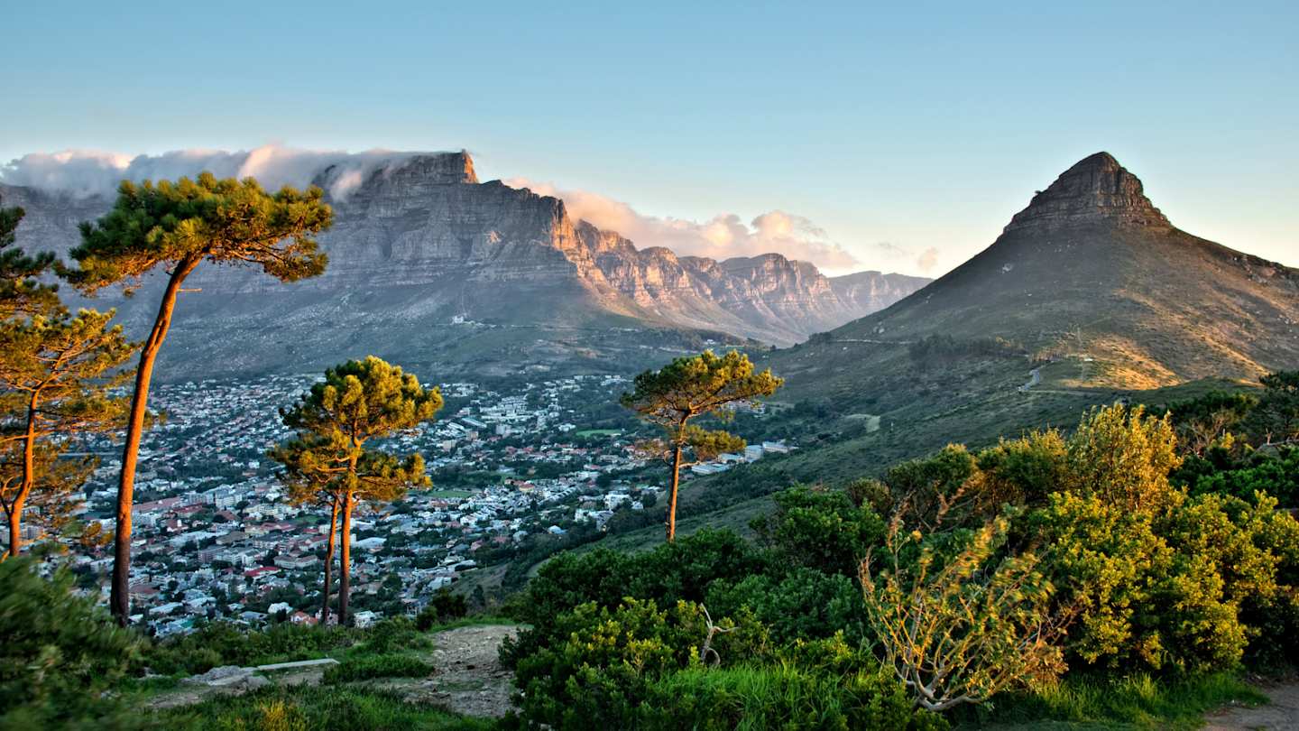 Clouds over Table Mountain and Lion's Head, as seen from Signal Hill, with views across the city, Cape Town