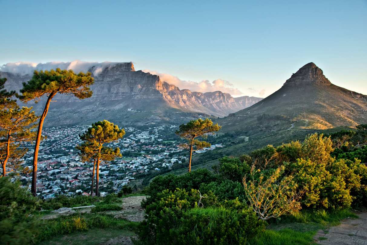 Clouds over Table Mountain and Lion's Head, as seen from Signal Hill, with views across the city, Cape Town
