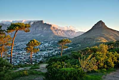 Clouds over Table Mountain and Lion's Head, as seen from Signal Hill, with views across the city, Cape Town