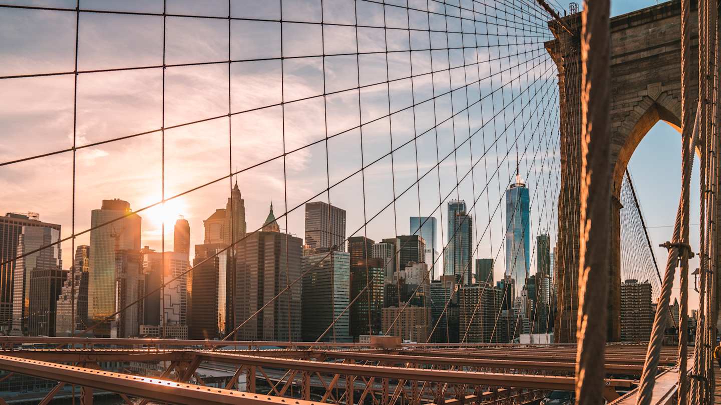 Manhattan skyline at sunset captured from the Brooklyn Bridge