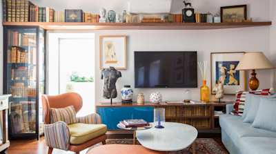 Living room lined with bookshelves