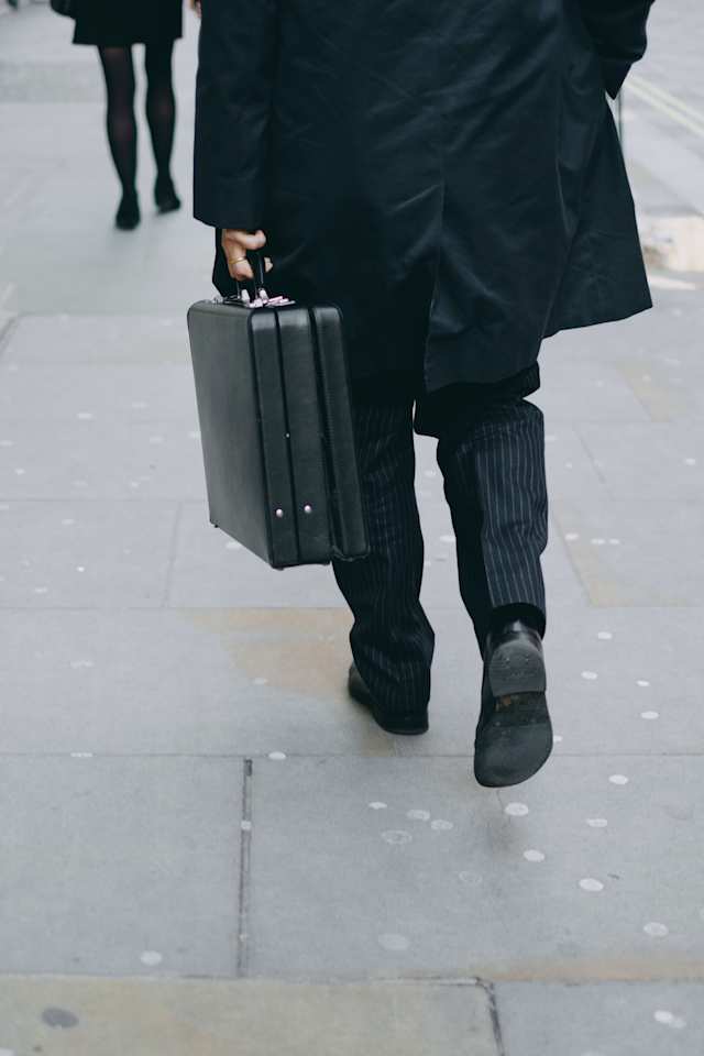 Businessman carrying a briefcase in London