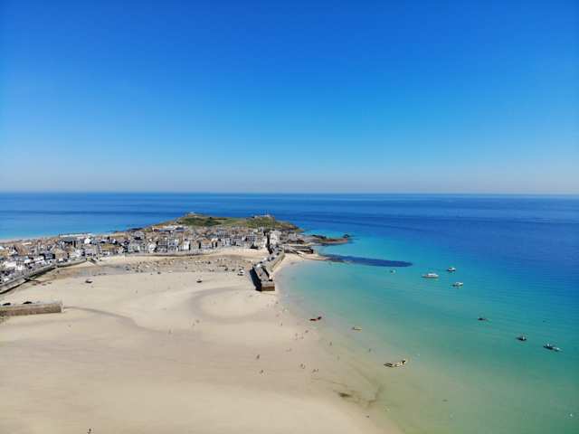 View of a beach and surrounding buildings at St Ives Harbour, Cornwall, England, UK