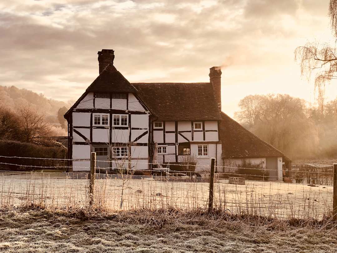 A white farmhouse on a misty morning, Surrey, UK