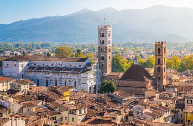 Panoramic sight in Lucca, with the Duomo of San Martino and mountains in the distance, Tuscany, Italy