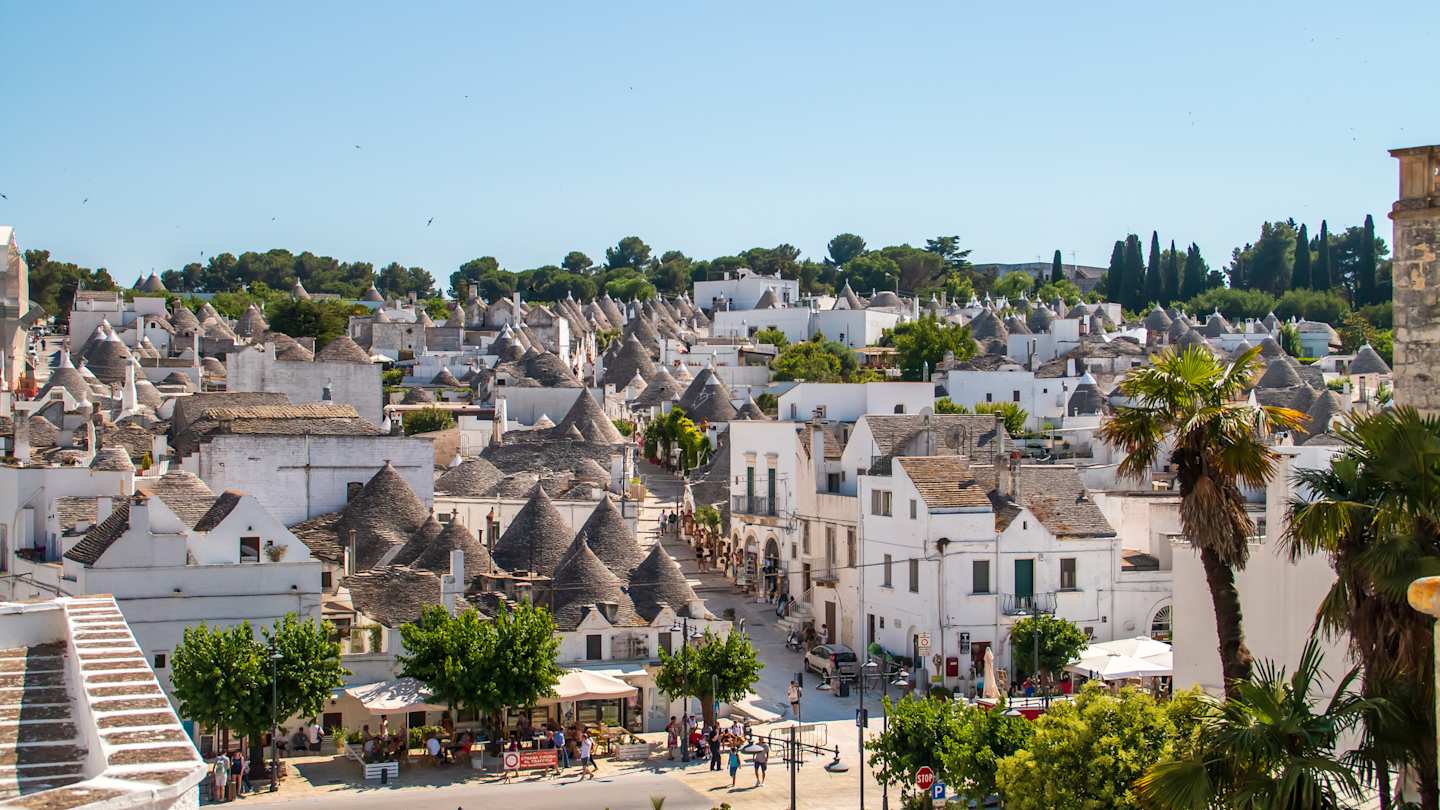 Street between trulli houses in Alberobello, Apulia, Italy