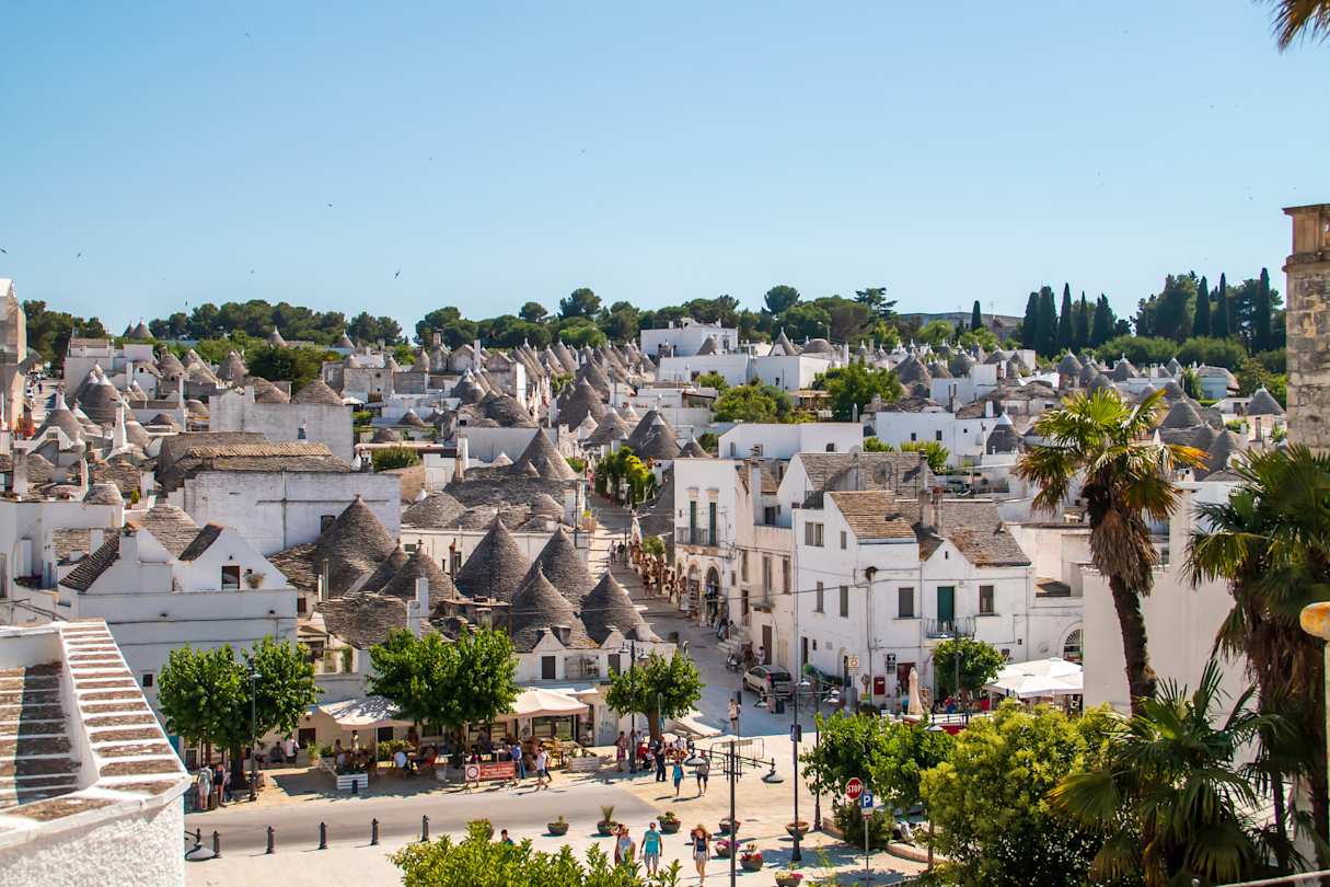 Street between trulli houses in Alberobello, Apulia, Italy