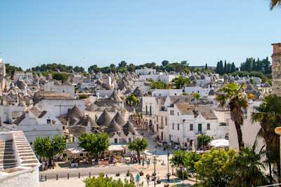 Street between trulli houses in Alberobello, Apulia, Italy