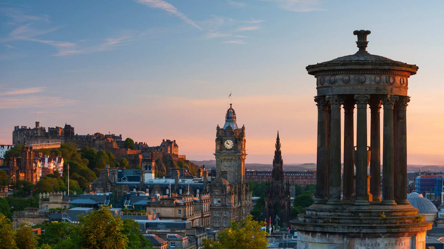 The skyline of Old Town city centre at sunset, as seen from to top of seen from Calton Hill, Edinburgh