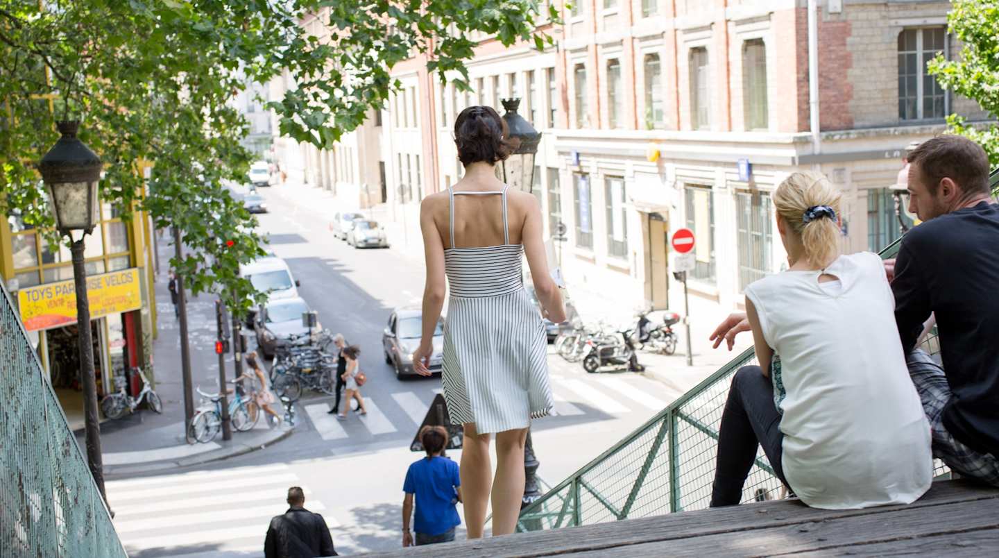 People walking down steps in Paris