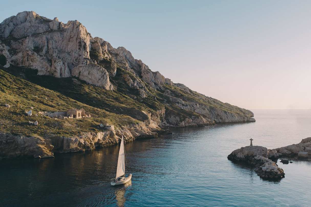 A boat on the water at dusk in the Côte D'Azur, Marseille, France