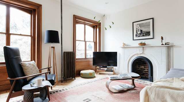 Bright living room with big fireplace in Plum Guide home, New Chelsea