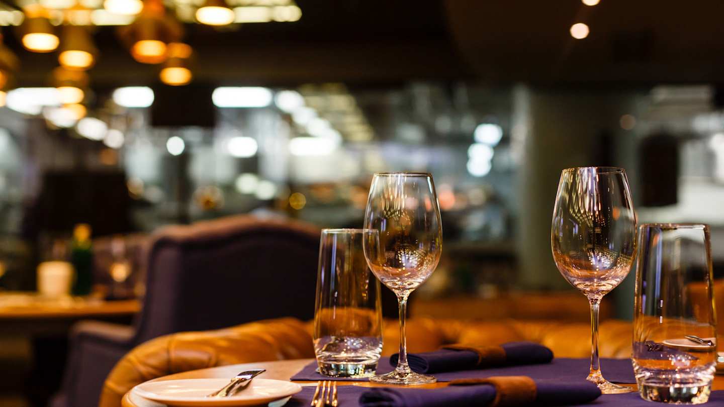 Wine glasses on a table at a fancy restaurant