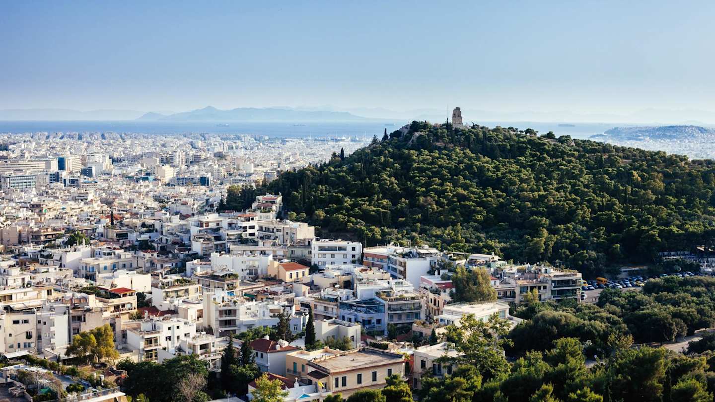 An aerial view of houses and trees in in Athens, Greece