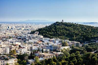 An aerial view of houses and trees in in Athens, Greece