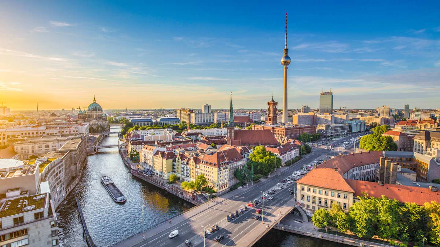 Aerial view of Berlin skyline with famous TV tower and Spree River in beautiful evening light at sunset, Berlin, Germany