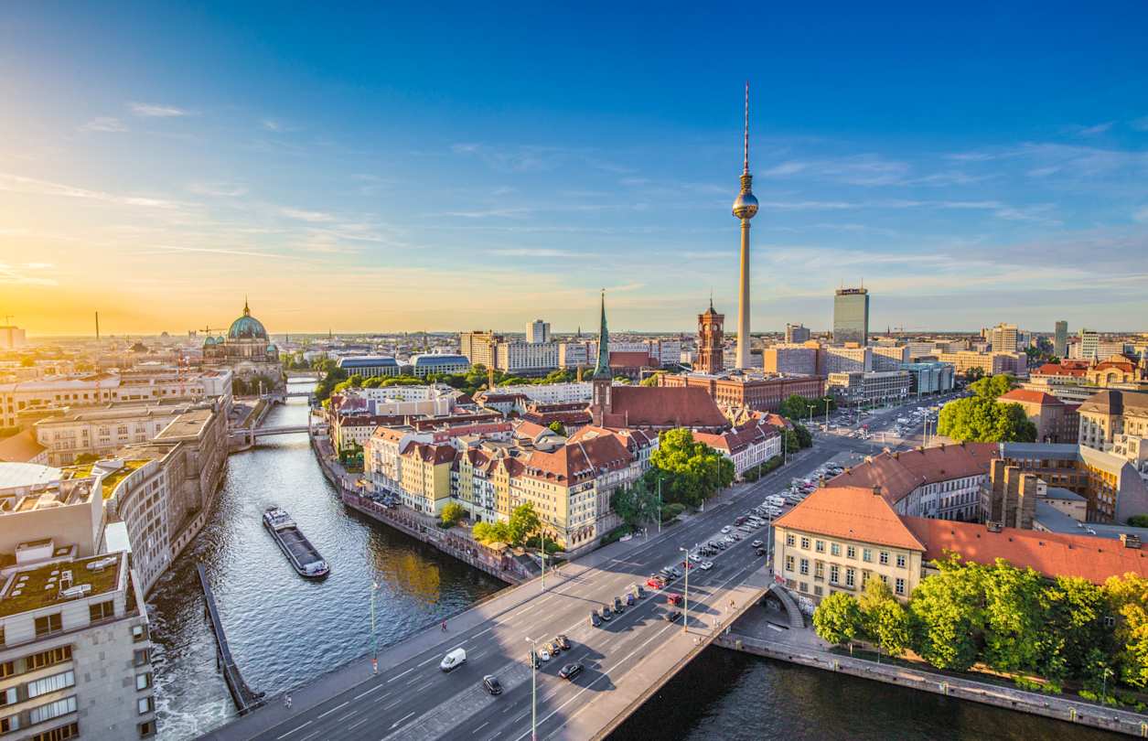 Aerial view of Berlin skyline with famous TV tower and Spree River in beautiful evening light at sunset, Berlin, Germany