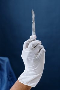 A scalpel blade is used for skin scrapes