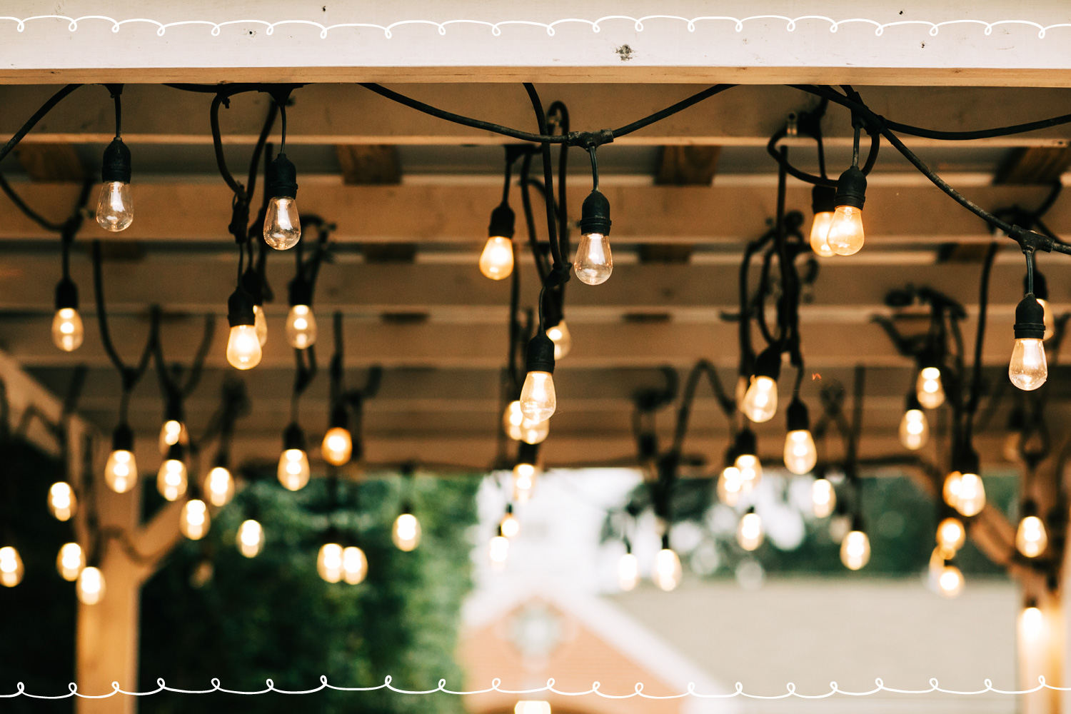 stringlights hanging from pergola outside
