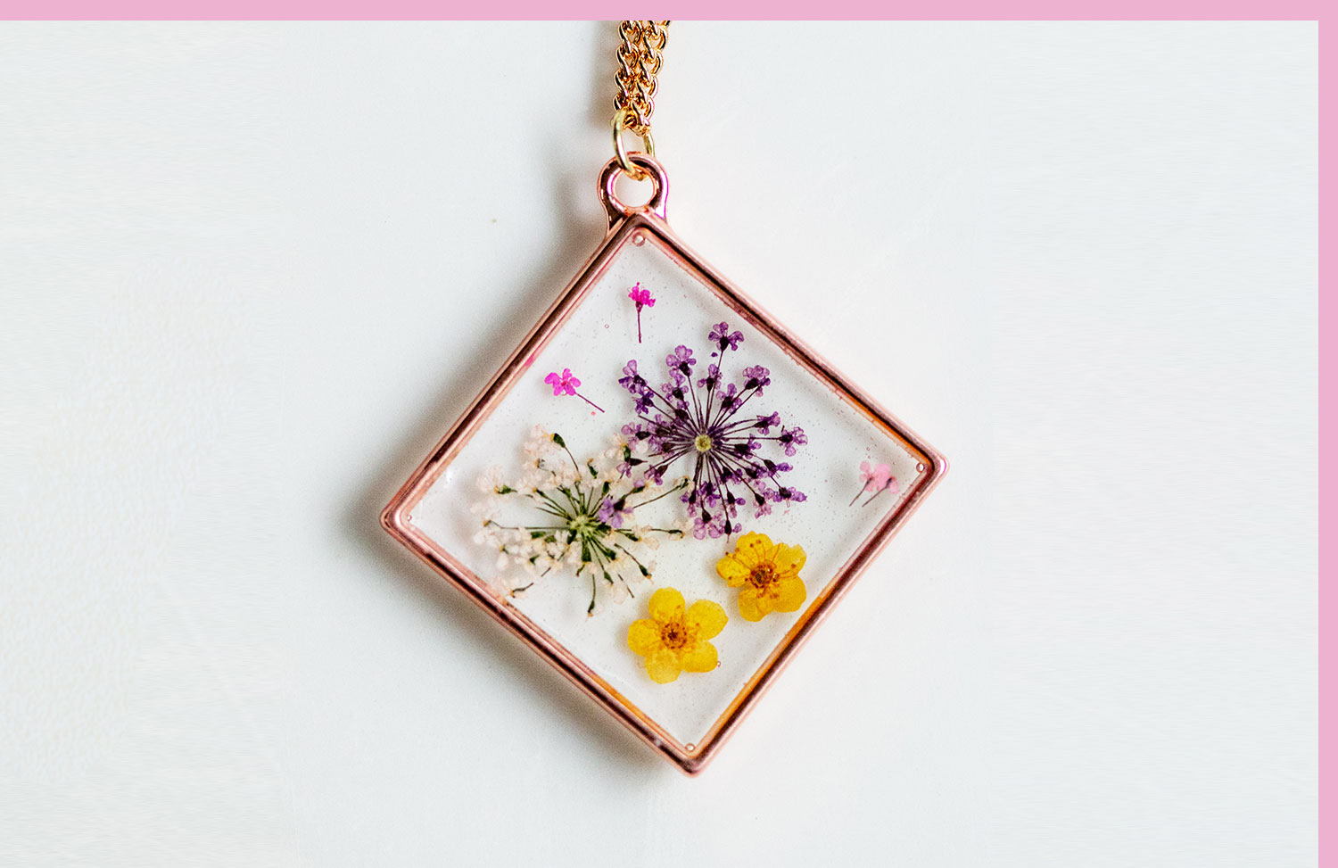 flowers pressed into a pendant necklace