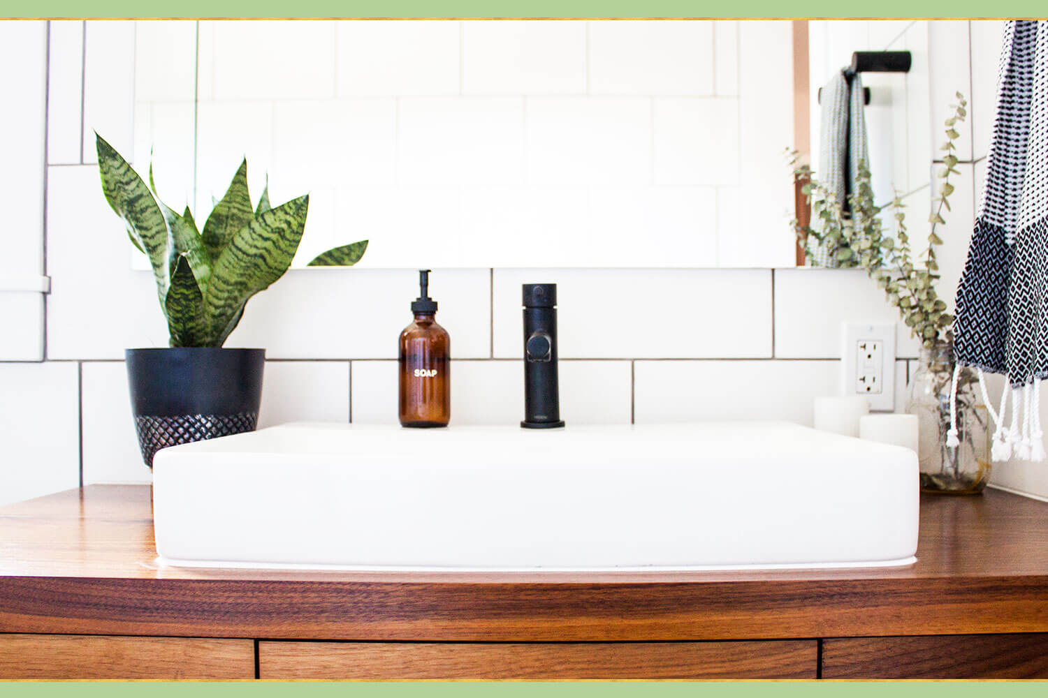 green plant on bathroom sink