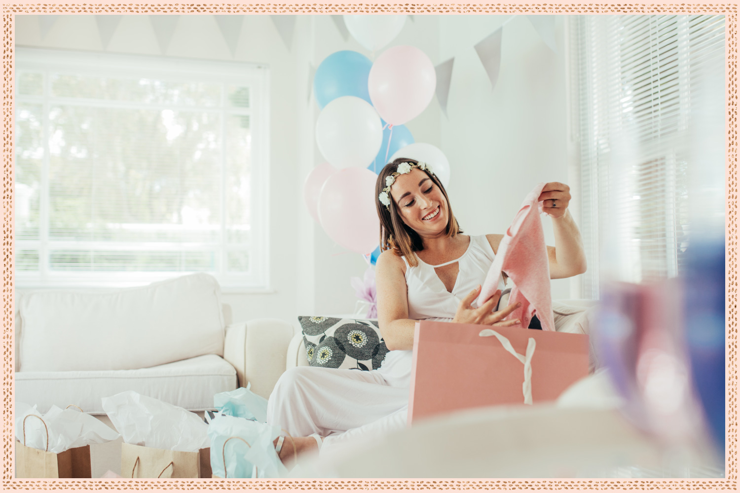 young woman with flowercrown unpacking gifts after baby shower