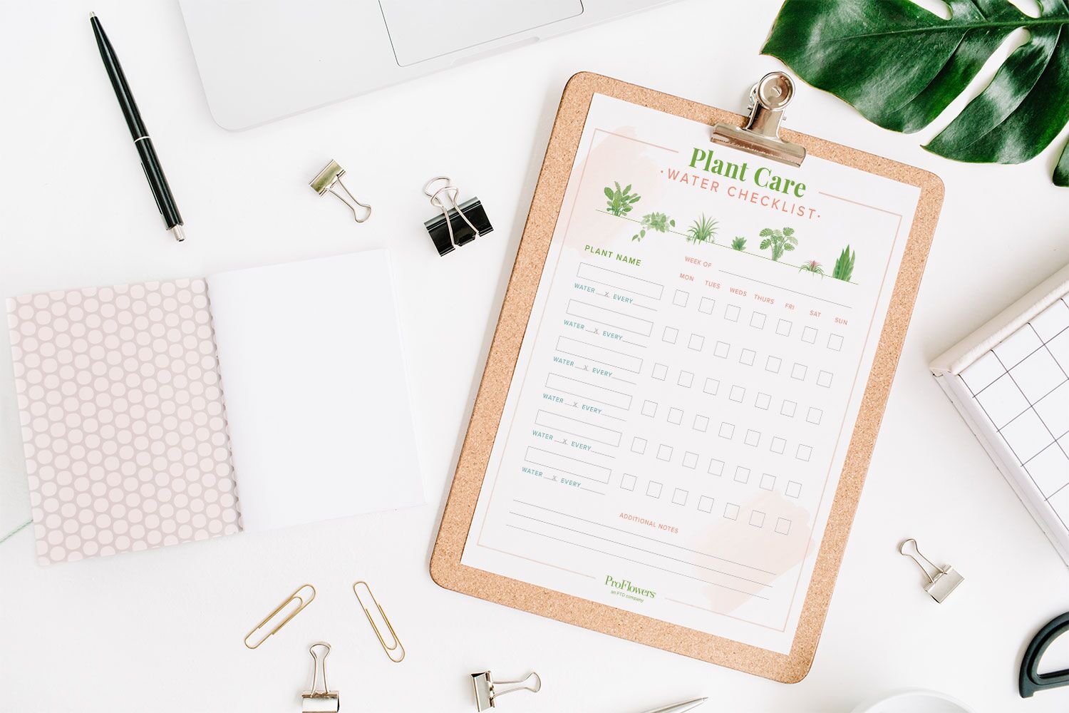plant water checklist on a clipboard on a desk with a white background
