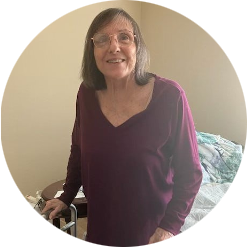 BAYADA Client standing and smiling at camera