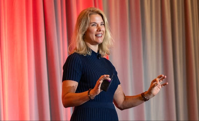 BAYADA president Heather Helle standing on stage